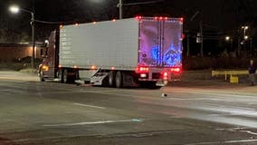 Detroit man charged after crashing Tesla under semi-truck, critically injuring woman