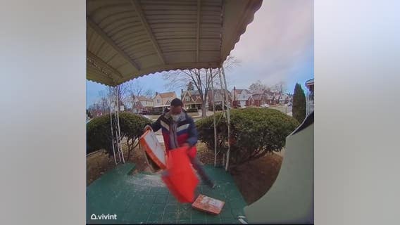 DoorDash driver caught on camera dropping pizza on ground, stuffing it back in box