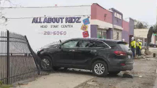 Woman loses control, crashes into Detroit daycare fence