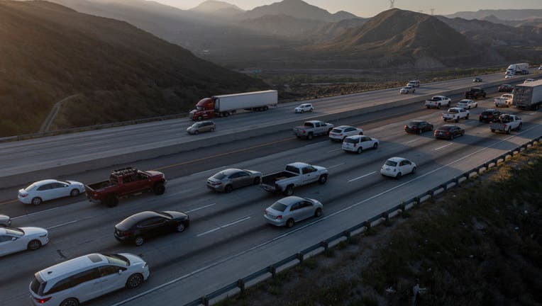 FILE - In an aerial view from a drone, the Interstate 15 freeway, which is heavily used by traffic between Southern California cities and Las Vegas, is shown where it crosses the San Andreas Fault on April 2, 2021 near Hesperia, California. (Photo by David McNew/Getty Images)