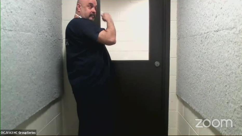Temo Sessions in a holding area after his virtual court hearing.