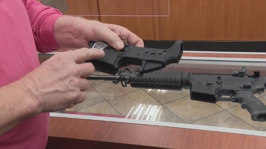 Action Impact owner William Kucyk shows how if gun parts are bought at his store, there are serial numbers to prevent the making of ghost guns that can't be traced.