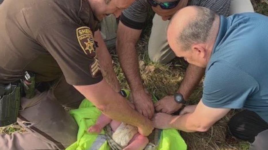 Oakland County Sheriff Deputies rescue a 4-month-old baby in the woods in Lake Orion on Wednesday, April 7.