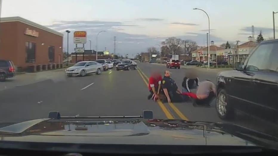 Dashcam video shows the suspect held down by a Dearborn police officer and three bystanders. The police chief praised how the situation was handled by all involved.