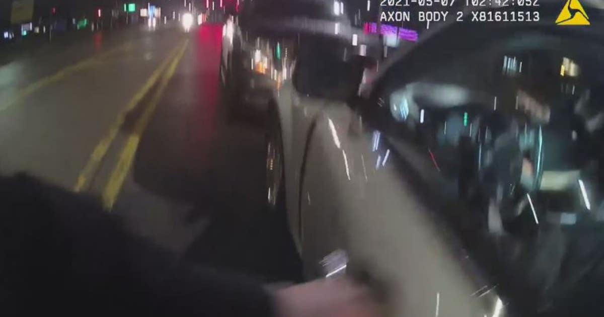 Police bodycam video shows rescue of overdosing driver inside running ...