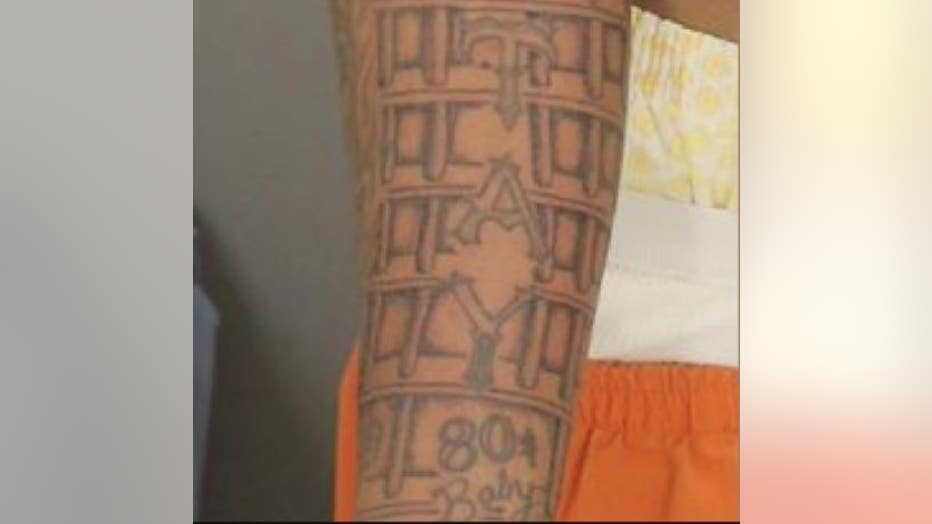 An identifying tattoo on Cox's arm.