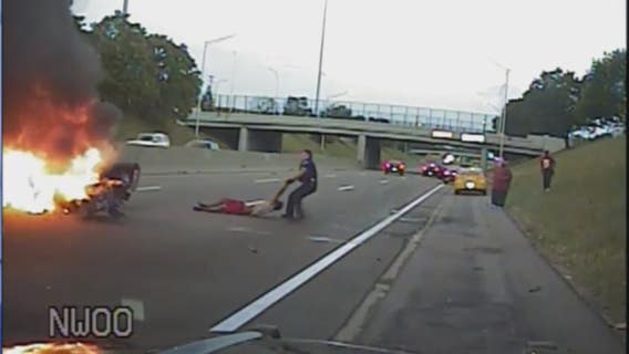Video: Police officer pulls man from burning car after I-94 crash