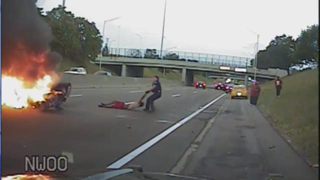 Video: Police officer pulls man from burning car after I-94 crash