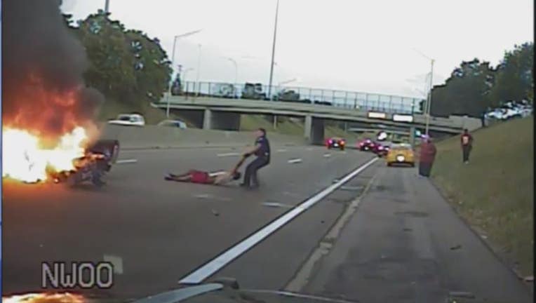 Harper Woods Officer Luke Pauley pulled the driver from a burning car to safety.