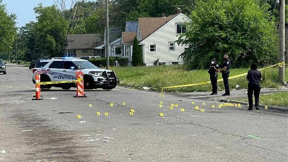 Evidence markers at the scene where a boy and his father were shot near Plymouth and St. Marys in Detroit. Photo by Veronica Meadows.