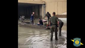 WATCH: Man rescued from roof of car after getting stranded on flooded Detroit freeway