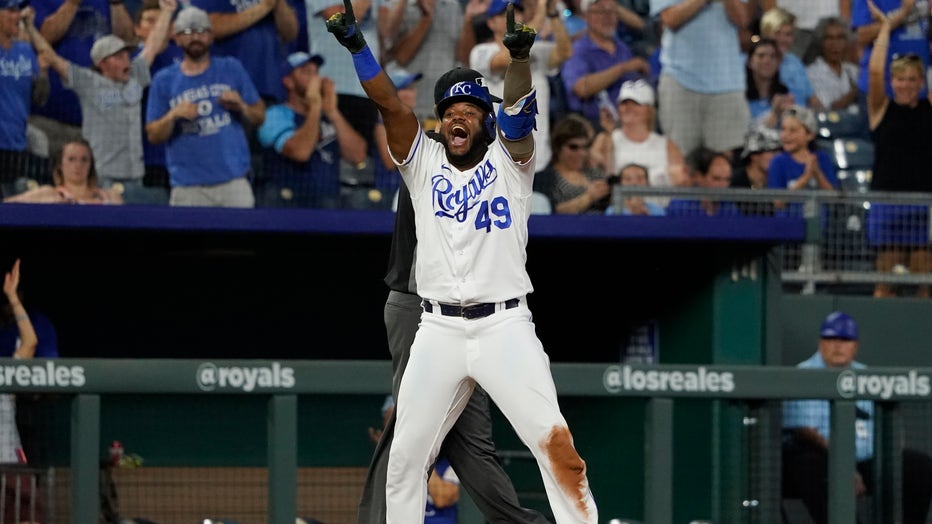 Kansas City Royals' Carlos Santana celebrates hitting an RBI