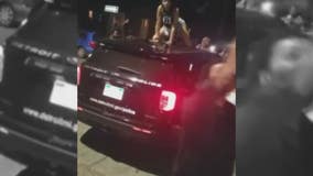 Video of woman dancing on top of Detroit police cruiser creates buzz online - and questions