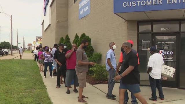 Line for dry ice wraps around building as power outage patience wears thin