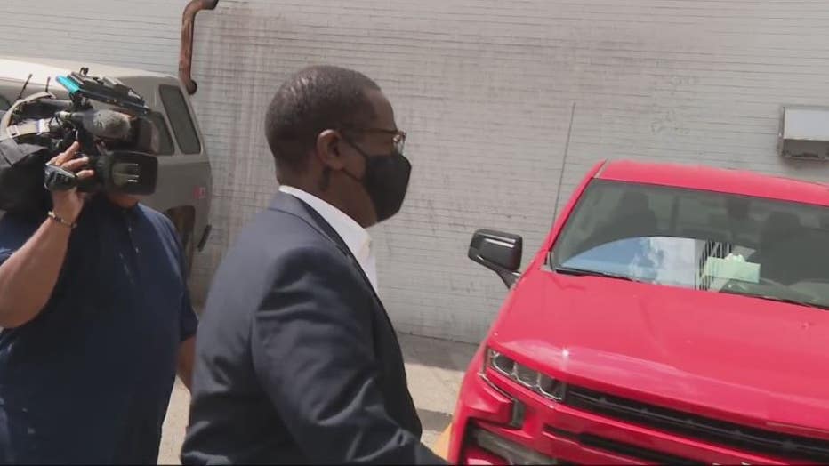 Detroit City Councilman Andre Spivey leaves federal court after a hearing on a bribery charge.