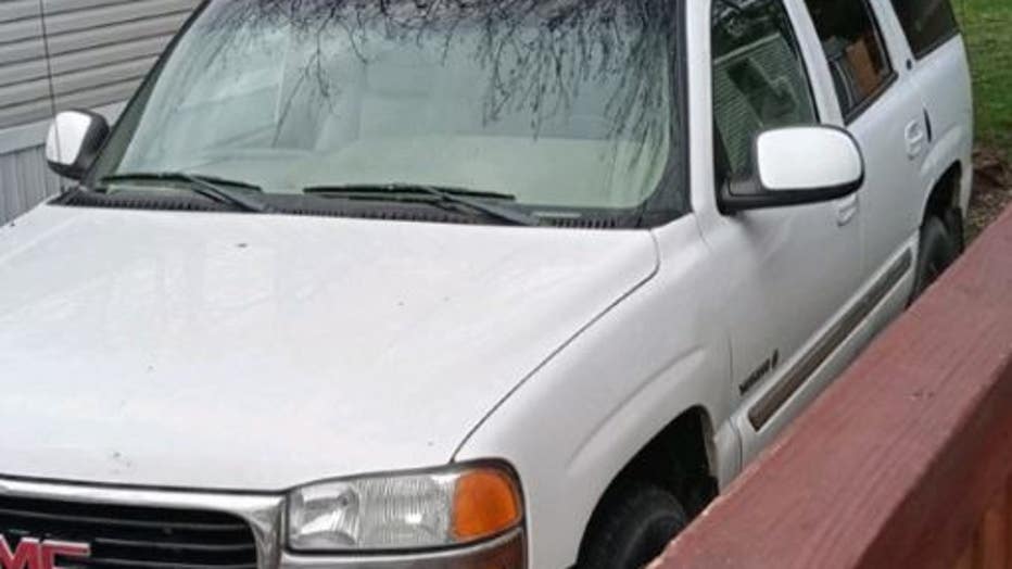 This is a photo of the stolen older white GMC Yukon which does not have a license plate.
