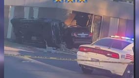 Speeding stolen SUV causes violent crash and careens through wall of building