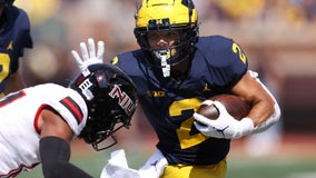 Corum's 3 TDs help No. 25 Michigan rout N. Illinois 63-10