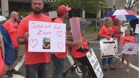 On anniversary of road worker's hit and run death, family protests driver's sentencing deal