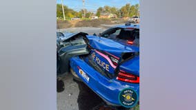 Driver slams into Michigan State Police patrol car while trooper works to remove abandoned vehicle from road