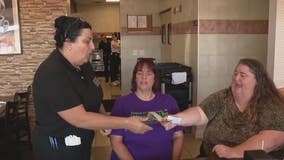 Women's group surprise restaurant servers with large tips