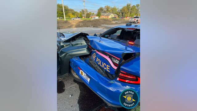 Driver slams into Michigan State Police patrol car while trooper works to remove abandoned vehicle from road