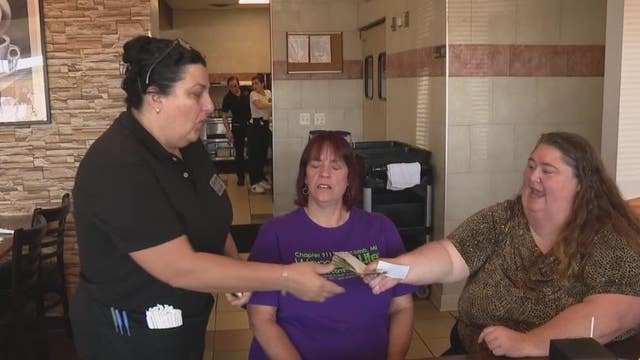 Women's group surprise restaurant servers with large tips