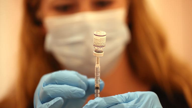 FILE - A pharmacist fills a syringe with the Pfizer COVID-19 booster vaccine at a vaccine booster vaccination clinic on Oct. 1, 2021 in San Rafael, California. (Photo by Justin Sullivan/Getty Images)
