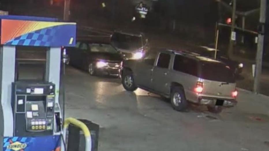 The suspect's vehicle, a Ford F-150 is at the rear of the security video stillshot.
