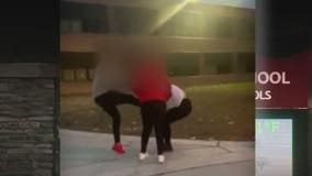 Woman joins girl in middle school fight, kicking child in face