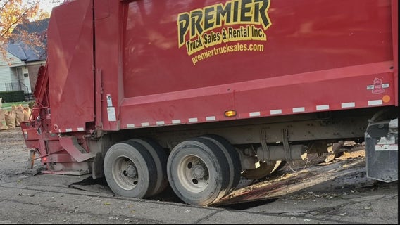 Garbage truck gets stuck in Dearborn sinkhole