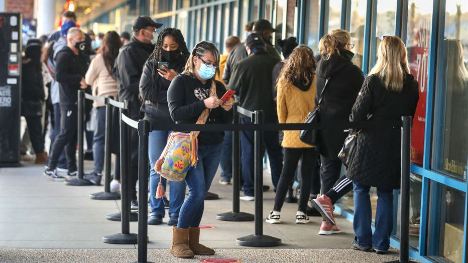 Shoppers line up at outlet store on Black Friday during pandemic