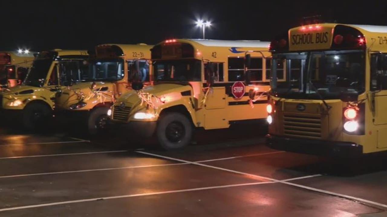 School buses from 13 different districts drive to Oxford HS to