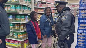 Detroit police 'Surprise Squad' delivers gift cards for the holidays