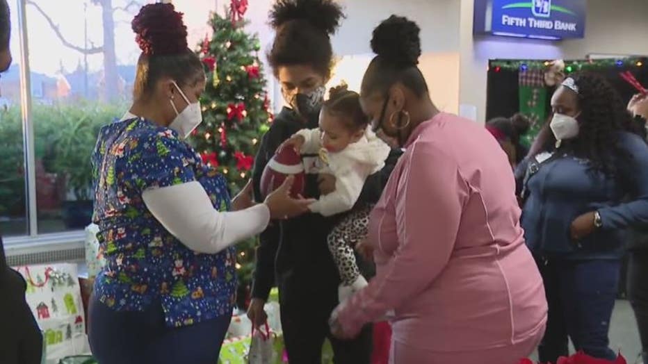 Lastar Jenkins and her family at a Christmas party thrown for them by her city of Detroit co-workers.