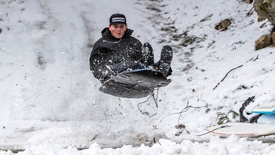 Southeast Michigan police departments from downriver competing in sled race