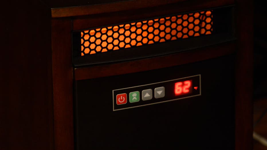 0414e21f-A space heater in the living room.Teresa Williams received financial help to heat her Windsor Street home in prior years through the LIHEAP program. She recently purchased space heaters to aid in the warmth. Photo by Jeremy Drey 1/10/2014