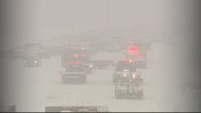 Multiple pileups and freeway closures during snow squall; one pedestrian accident