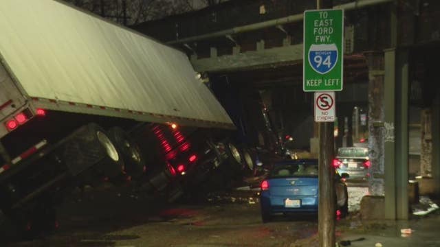 Semi-truck slams into train overpass in Detroit