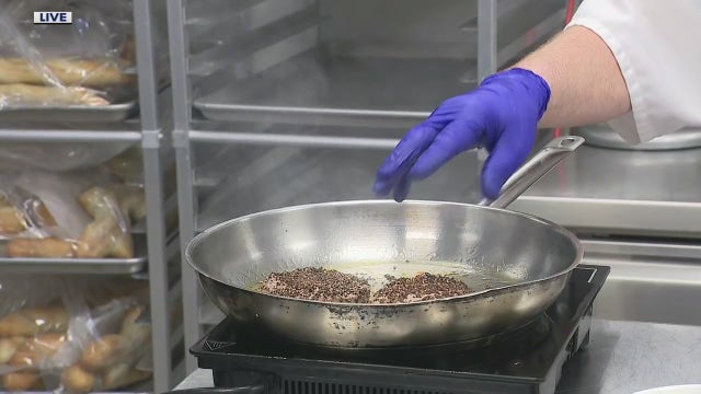 Preparing Steak au Poivre at Andiamo's new bistro the Statler