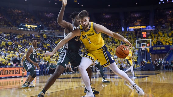 Dickinson scores 33, Michigan beats Michigan St. 87-70