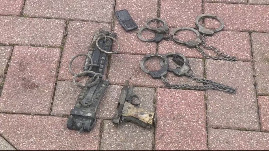 Magnet fishermen find handcuffs, firearms, and bottle caps in Detroit River