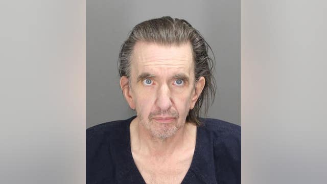 Man who lived with dead roommate a month charged; foul play ruled out