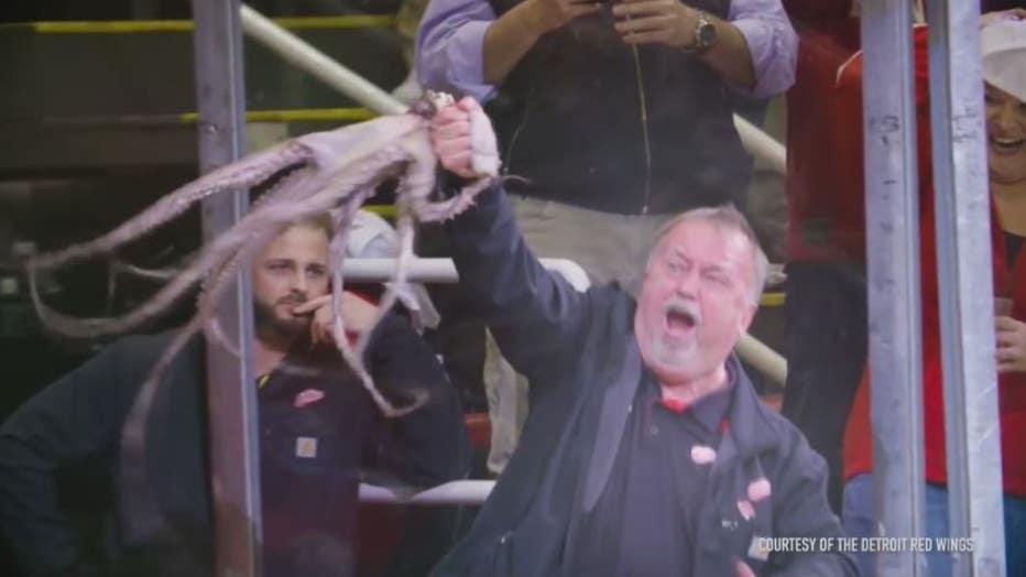 Al Sobotka removes an octopus from the ice during the playoffs - a Red Wings tradition. Photo courtesy: Detroit Red Wings