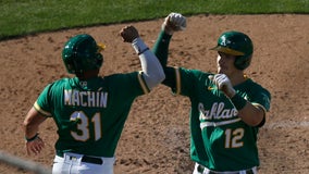 Murphy's 3-run homer helps A's split doubleheader with Tigers