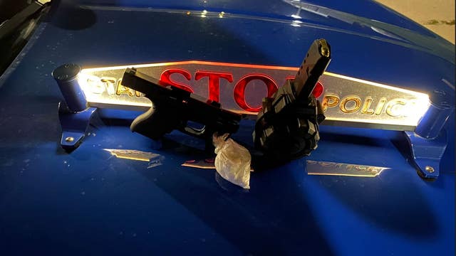 Detroit man found with stolen firearm, bag of pills in pants during traffic stop