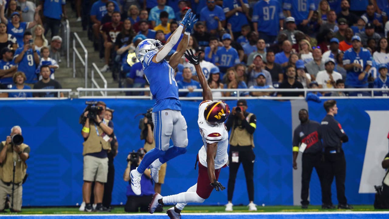 Detroit Lions WR AmonRa St Brown Photos of his NFL career