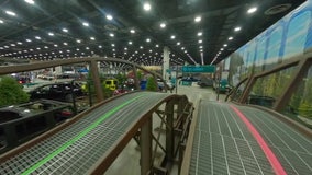 Touring the Jeep exhibit at the Detroit Auto Show from a first-person drone