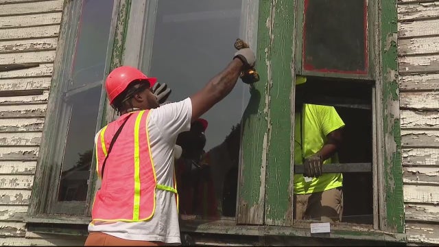 Detroit adds plexiglass instead of boards to windows of vacant homes that can be saved