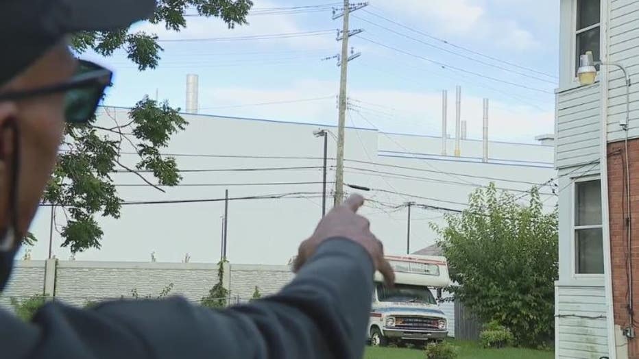 Resident Robert Shobe points at the Stellantis Plant which backs up to his home in Detroit.